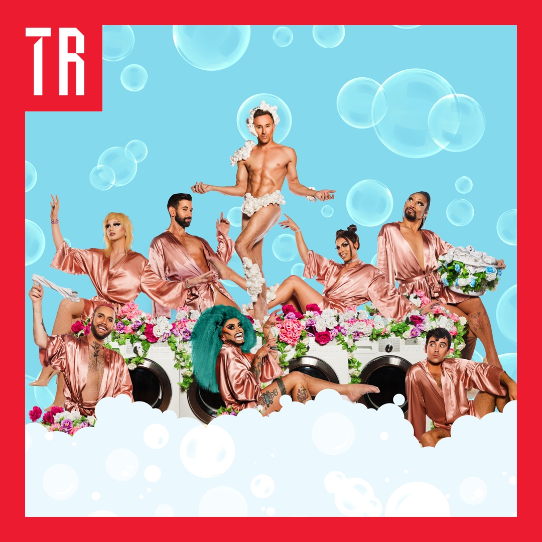 Image: Joel Devereux A group of people wear pink silk robes hold excellent poses. There is one figure at the top of the image that is not wearing many clothes and has their arms out in a Jesus like pose.