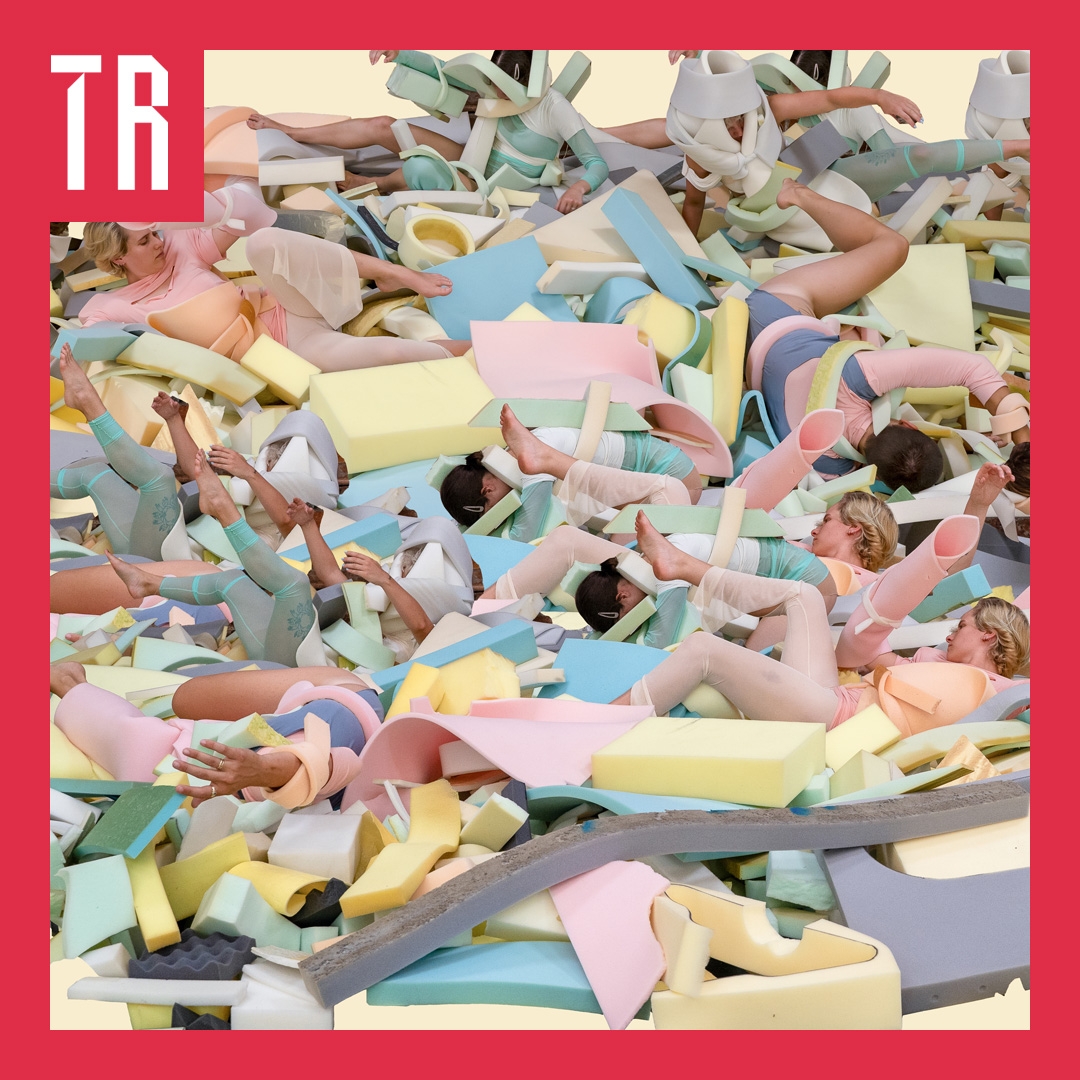 Body Bosy Commodity HERO image A landscape of coloured foam pieces and female bodies entwine in a chaotic way