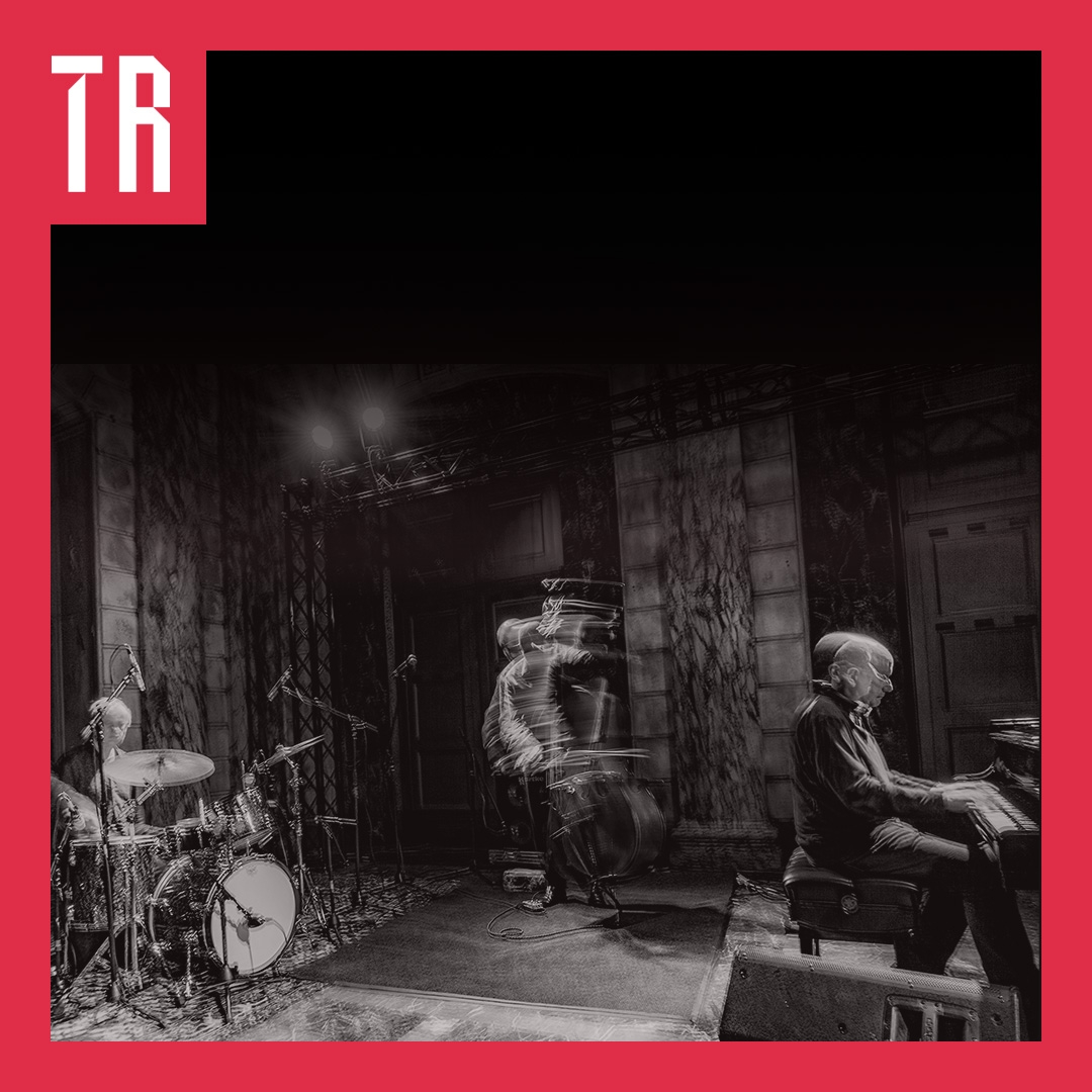 Photo: Devin Oktar Yalkin A distorted black and white image of three musicians playing music in a bohemian setting