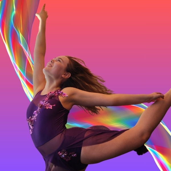 ATJ Dance School SHowcase A young girl dances against a pink and rainbow background. She looks happy