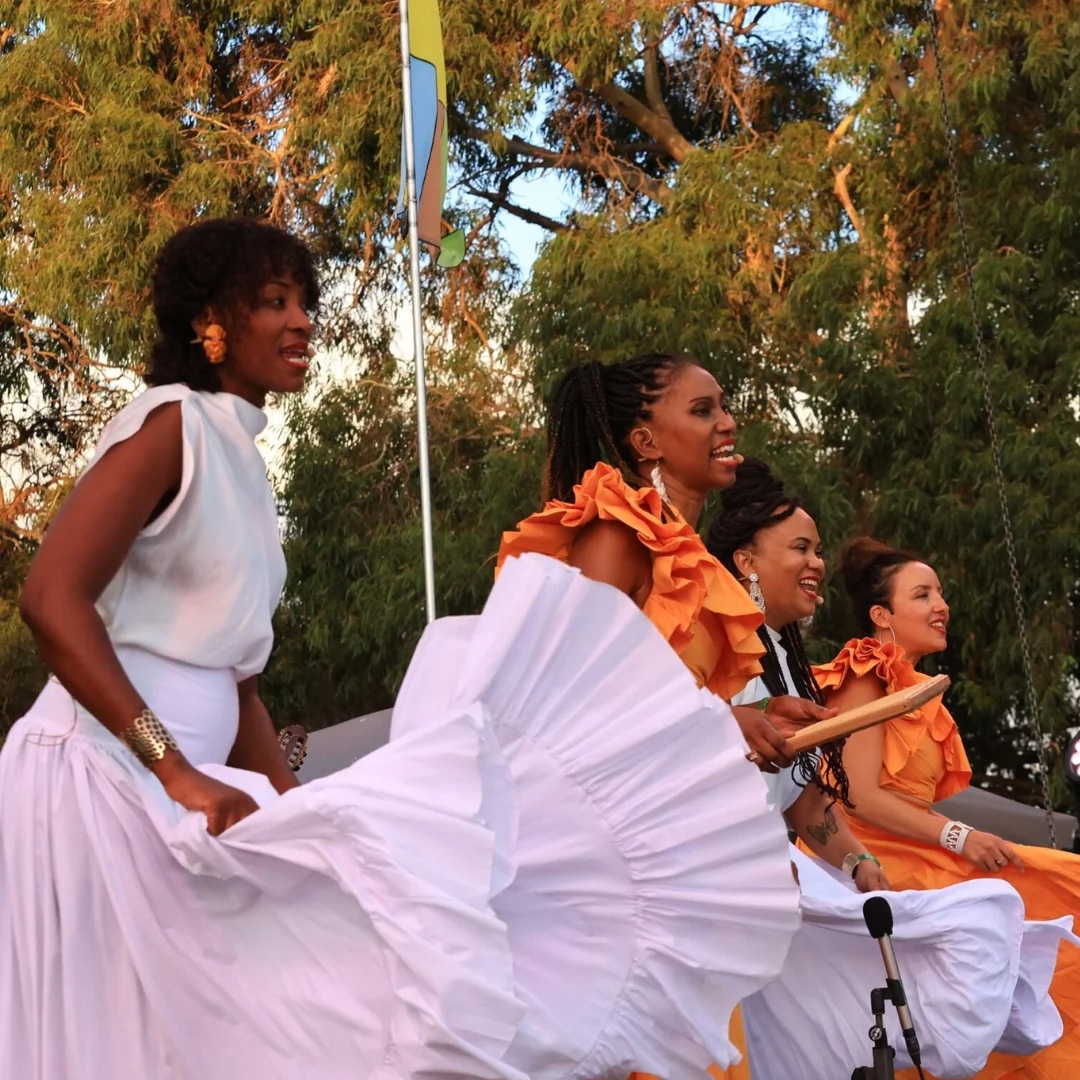 Salama-Creole-Worshop Hero 4 Creole dancers and percussionists wearing white and orange dresses