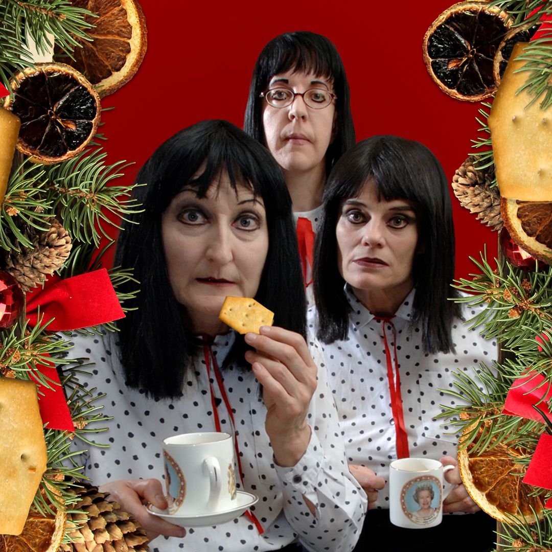 Image: supplied Three women wearing the same white and black polka dot shirts and mid length black bob, hold cups of tea and creackers. The image is decorated with victorian christmas decorations, the back ground a deep red. It is comical and a little creepy