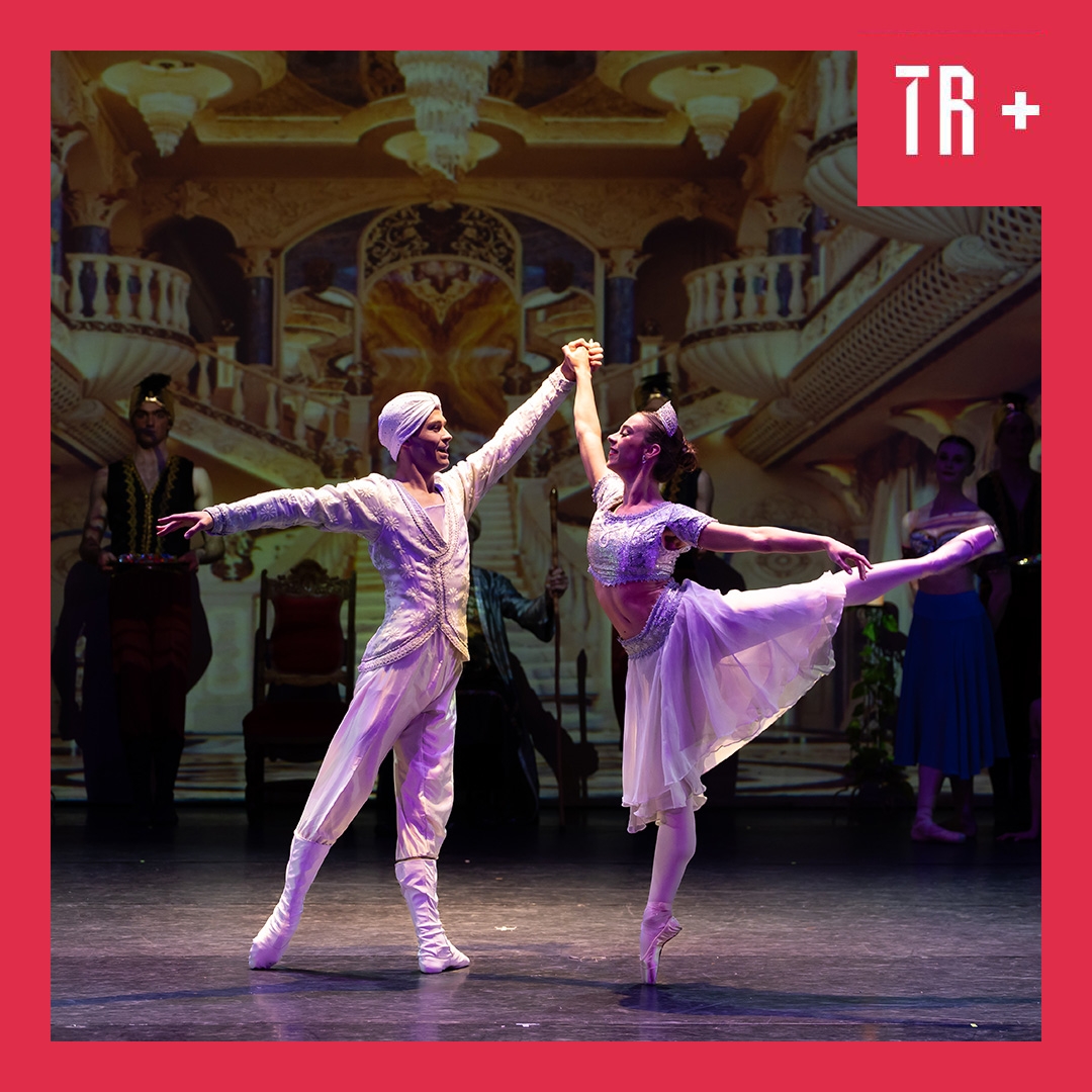 A male and female ballet dancer pose dramatically against an oriental backdrop