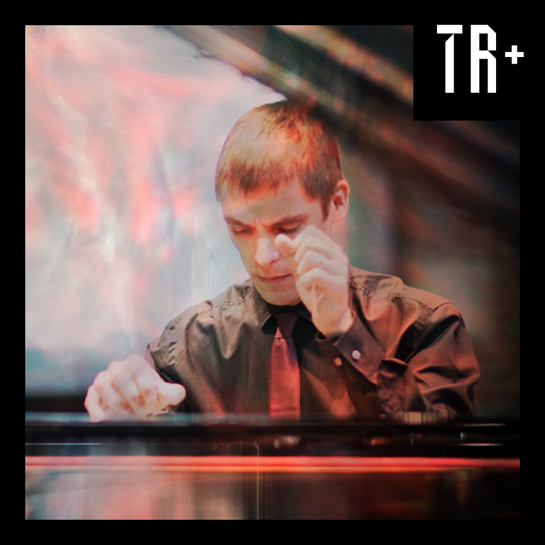 A close up image of a male musician overlaid with a texture that looks like exposed light. Its is a close up sho t of him sitting at a grand piano mid playing