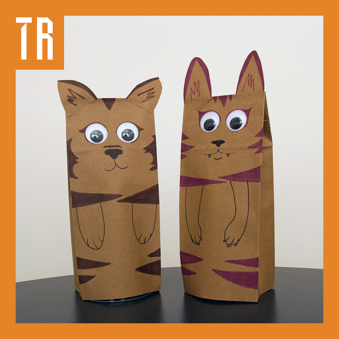 Two thylacine paper bag puppets