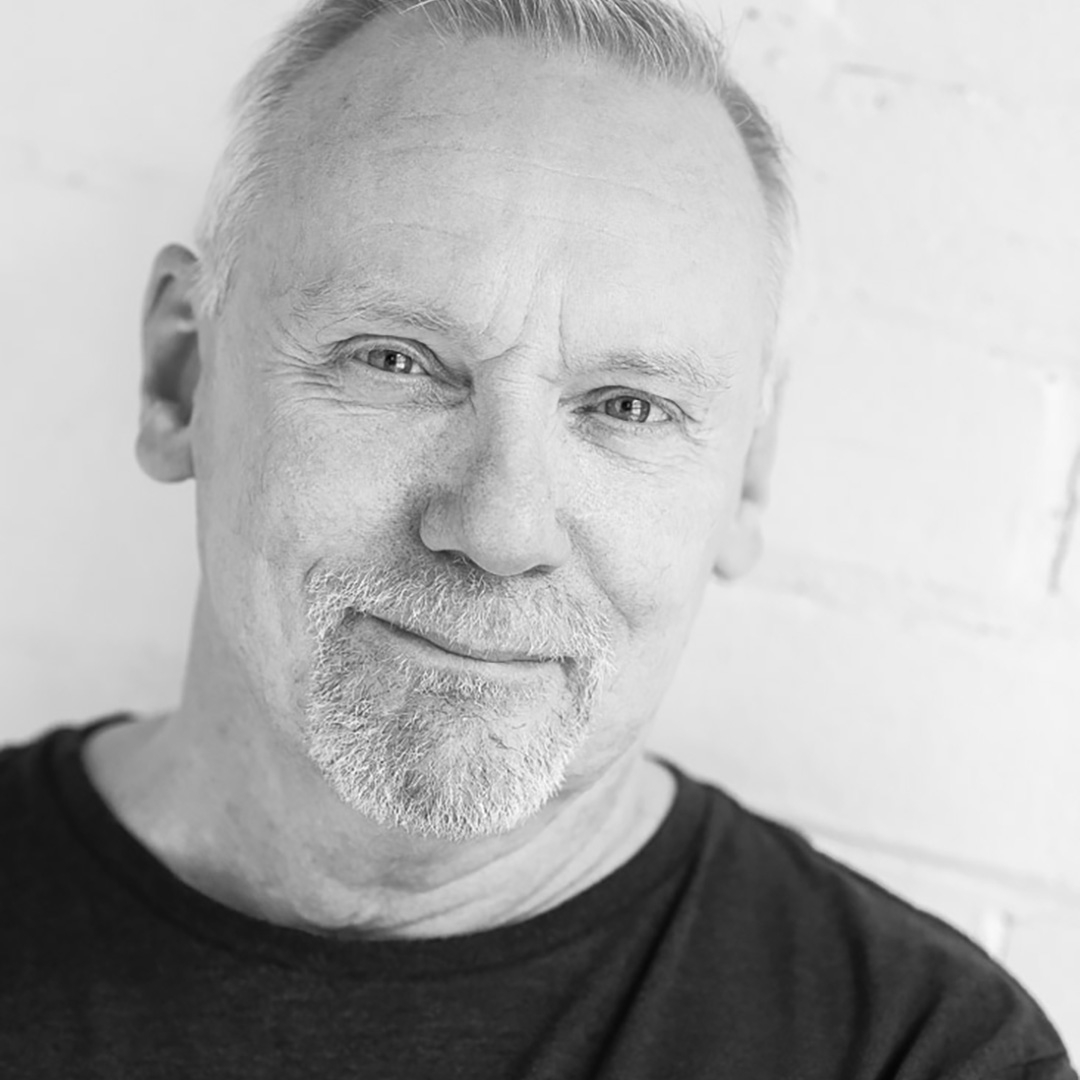 A black and white portrait of Robert Jarman