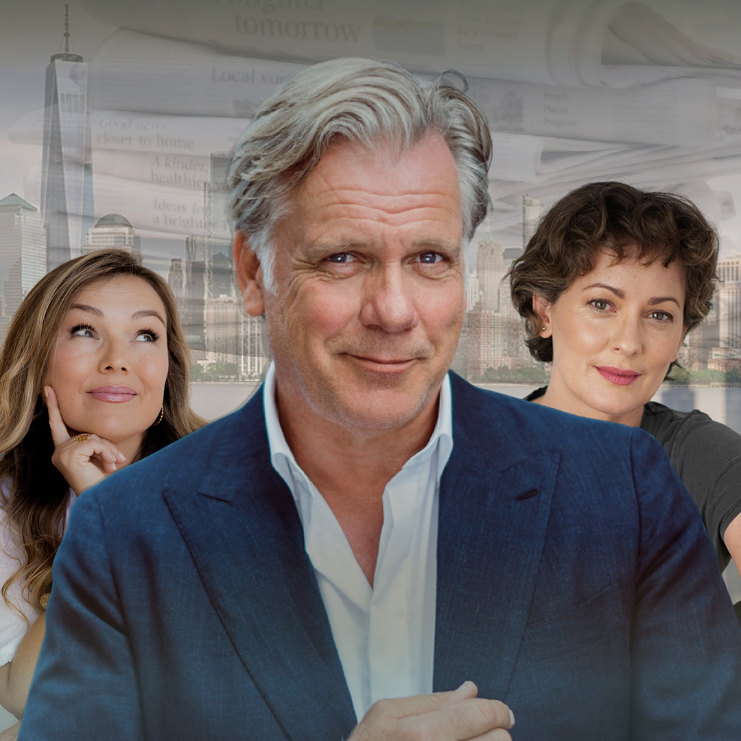 Three adults pose in front of a backdrop of a City skyline and layered newspaper pages. A silver-haired man in a navy suit stands in the centre, flanked by two women, one with long highlighted brown hair looking upward thoughtfully and another with short curly brown hair smiling gently at the camera.