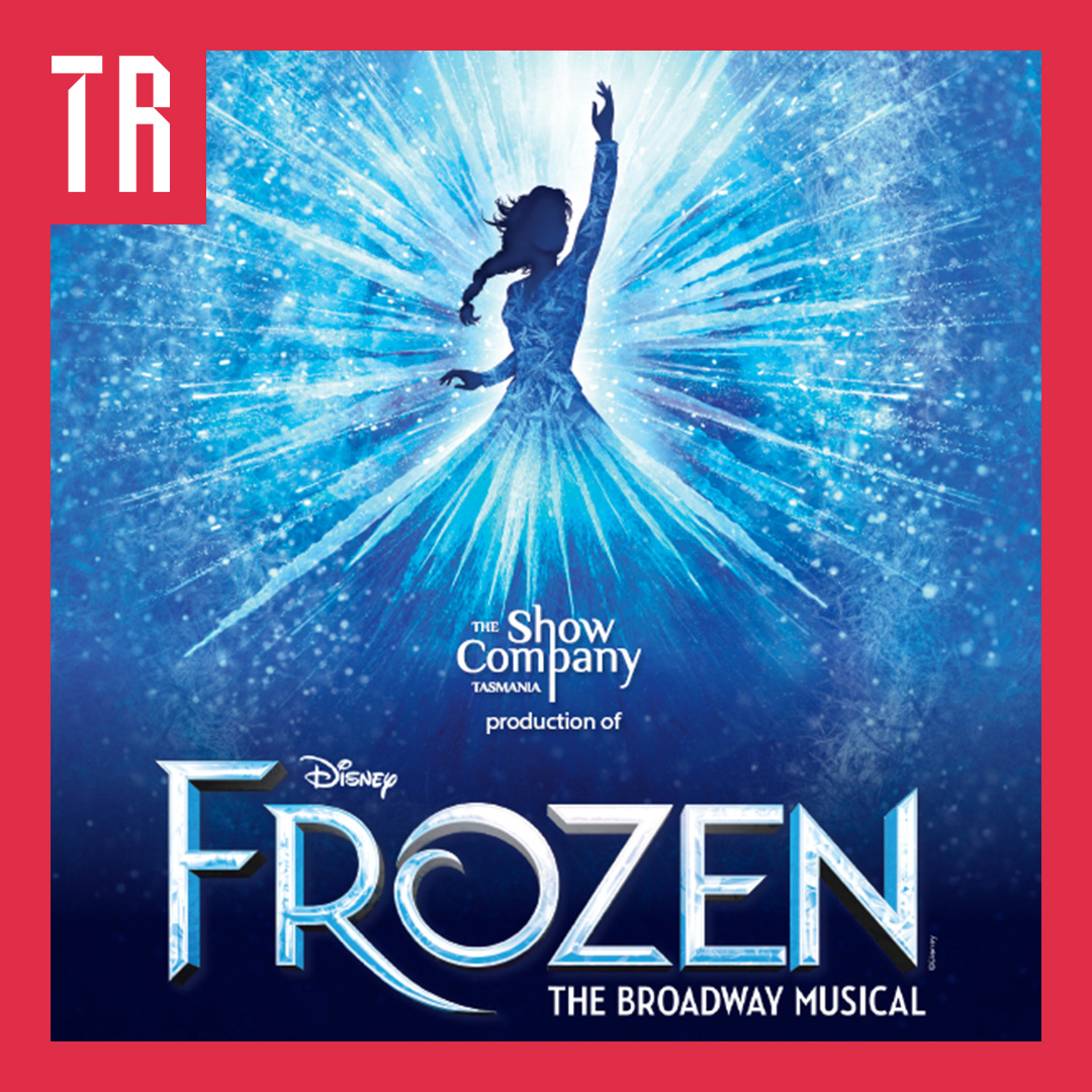 Square promotional poster for Disney’s Frozen: The Broadway Musical, presented by The Show Company Tasmania. A silhouetted woman in an elegant ice-blue gown raises one arm against a dazzling burst of icy blue and white light, surrounded by sparkling snowflakes and frost patterns. The lower half features the large, icy silver-and-blue “FROZEN” title, the Disney logo, and the subtitle “THE BROADWAY MUSICAL.” A bold red border frames the poster, with stylized white lettering in the upper-left corner.