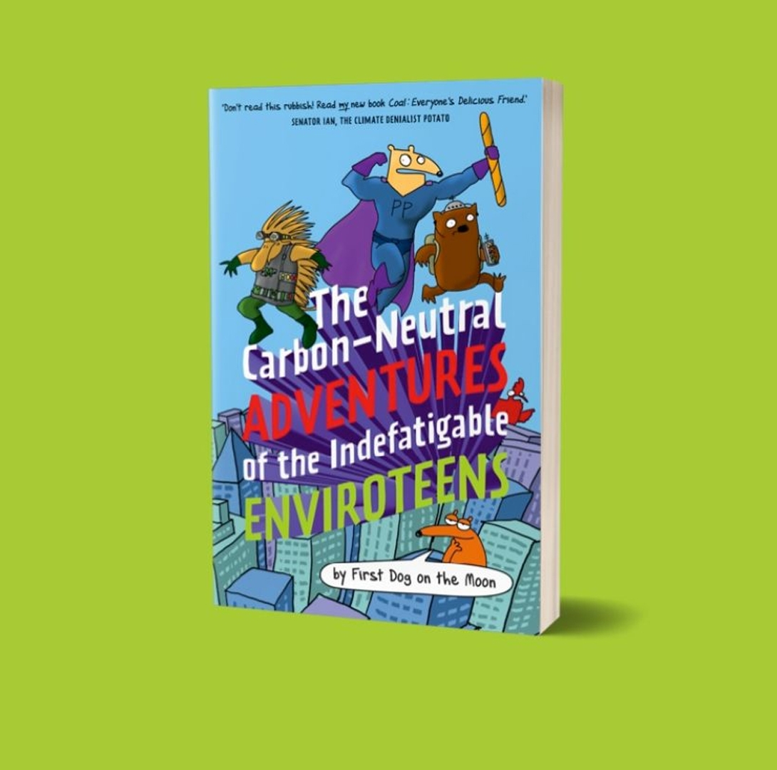 A copy of First Dog on the Moon's The Carbon Neutral Adventures of the Indefatigable Enviroteens sits on a lime green background