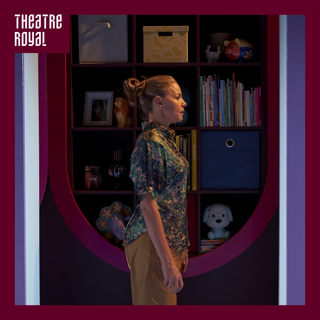 Photo: Matt Byrne A woman is seen in profile. She looks to the right of the image. She stands in front of a bookcase filled with things