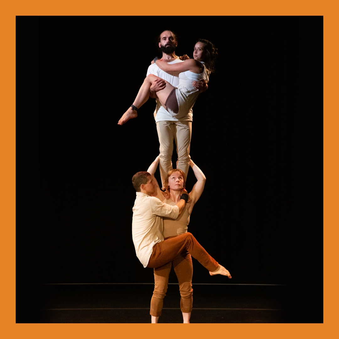 Photo: Hamish McCormick A man stands on a woman's shoulders. Another man and woman hang off them.